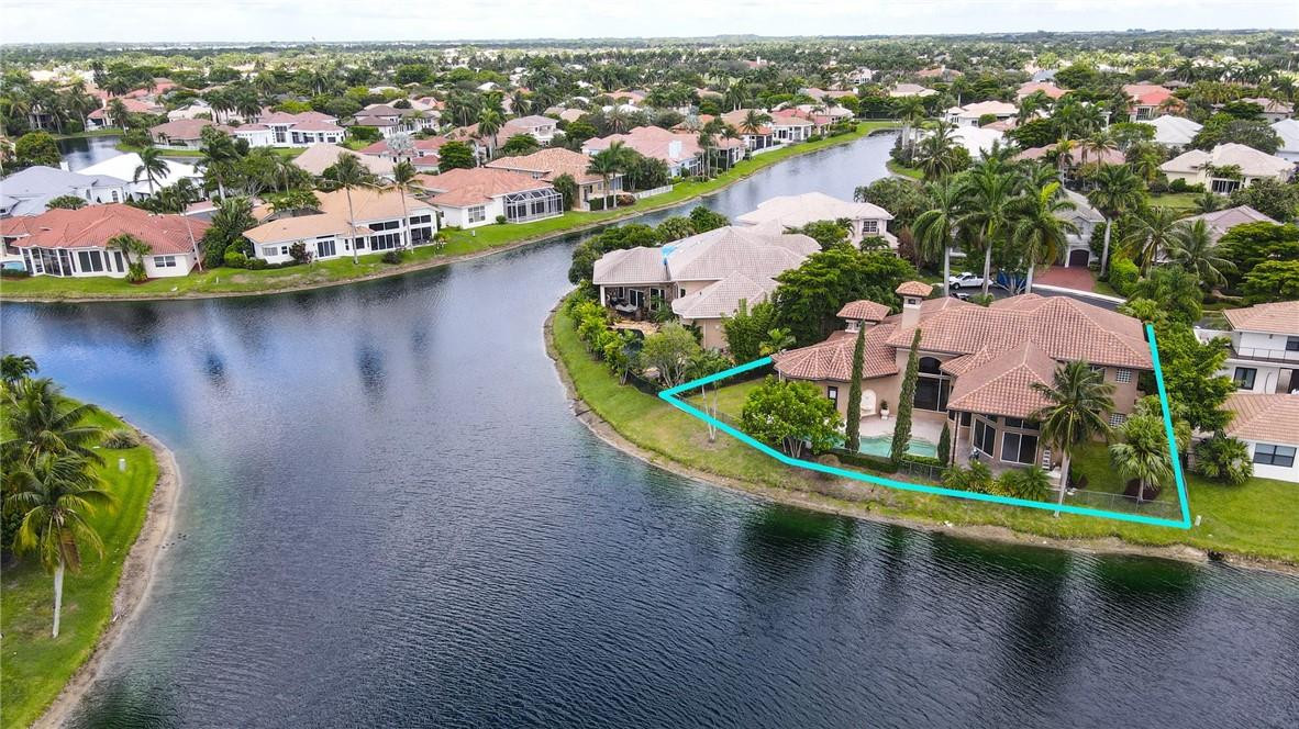 6468 Northwest 31st Way Boca Raton, FL 33496 - Photo 41 of 43 an aerial view of residential houses with outdoor space