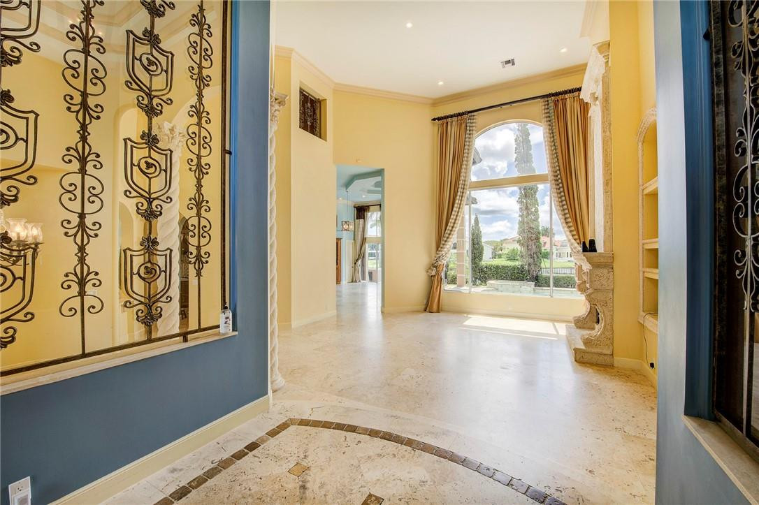 6468 Northwest 31st Way Boca Raton, FL 33496 - Photo 5 of 43 a view of an entryway with wooden floor and a window