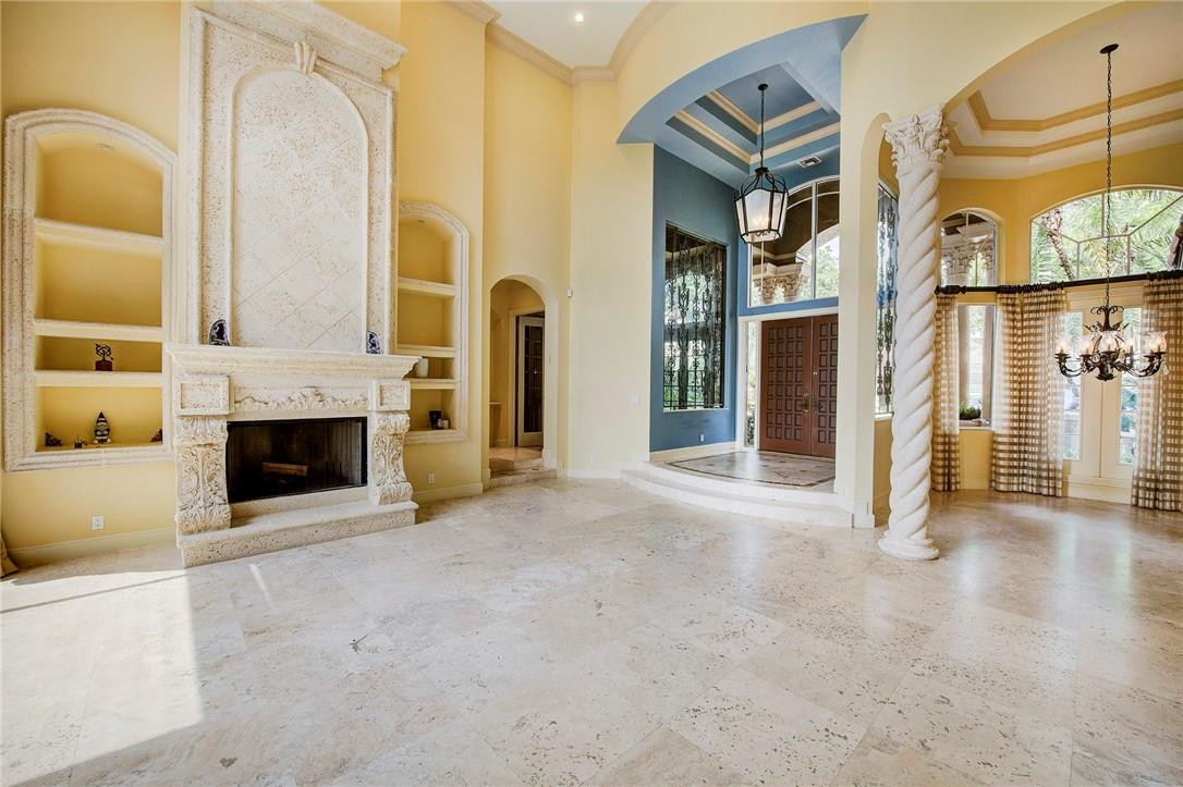 6468 Northwest 31st Way Boca Raton, FL 33496 - Photo 8 of 43 a view of an empty room with fireplace and a window