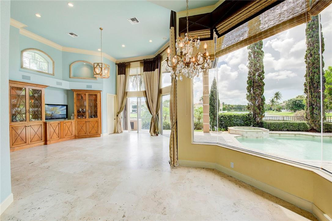 6468 Northwest 31st Way Boca Raton, FL 33496 - Photo 9 of 43 a view of an entryway with a floor to ceiling windows and a room