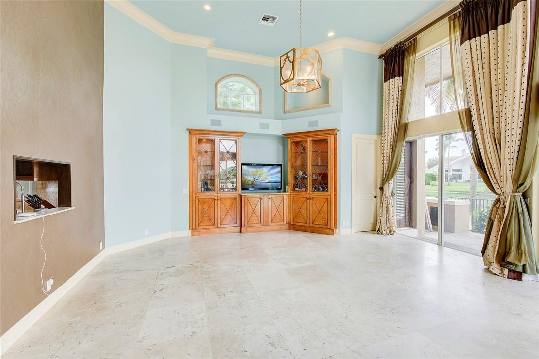 6468 Northwest 31st Way Boca Raton, FL 33496 - Photo 10 of 43 a view of a hallway with a large window with the view of balcony