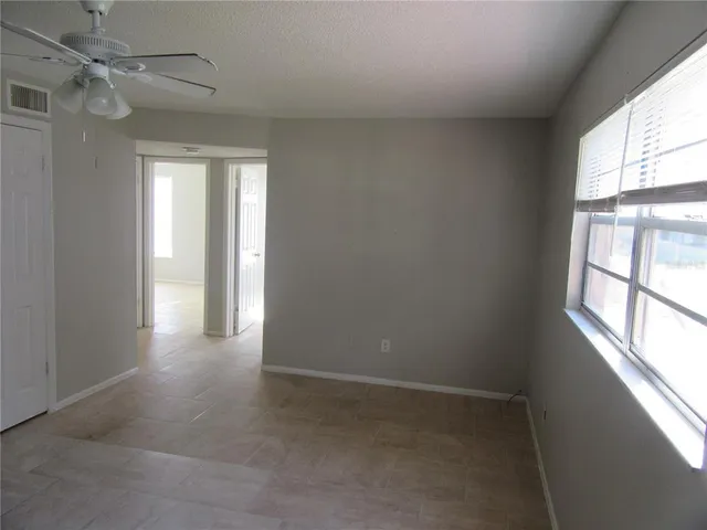 a view of empty room with windows