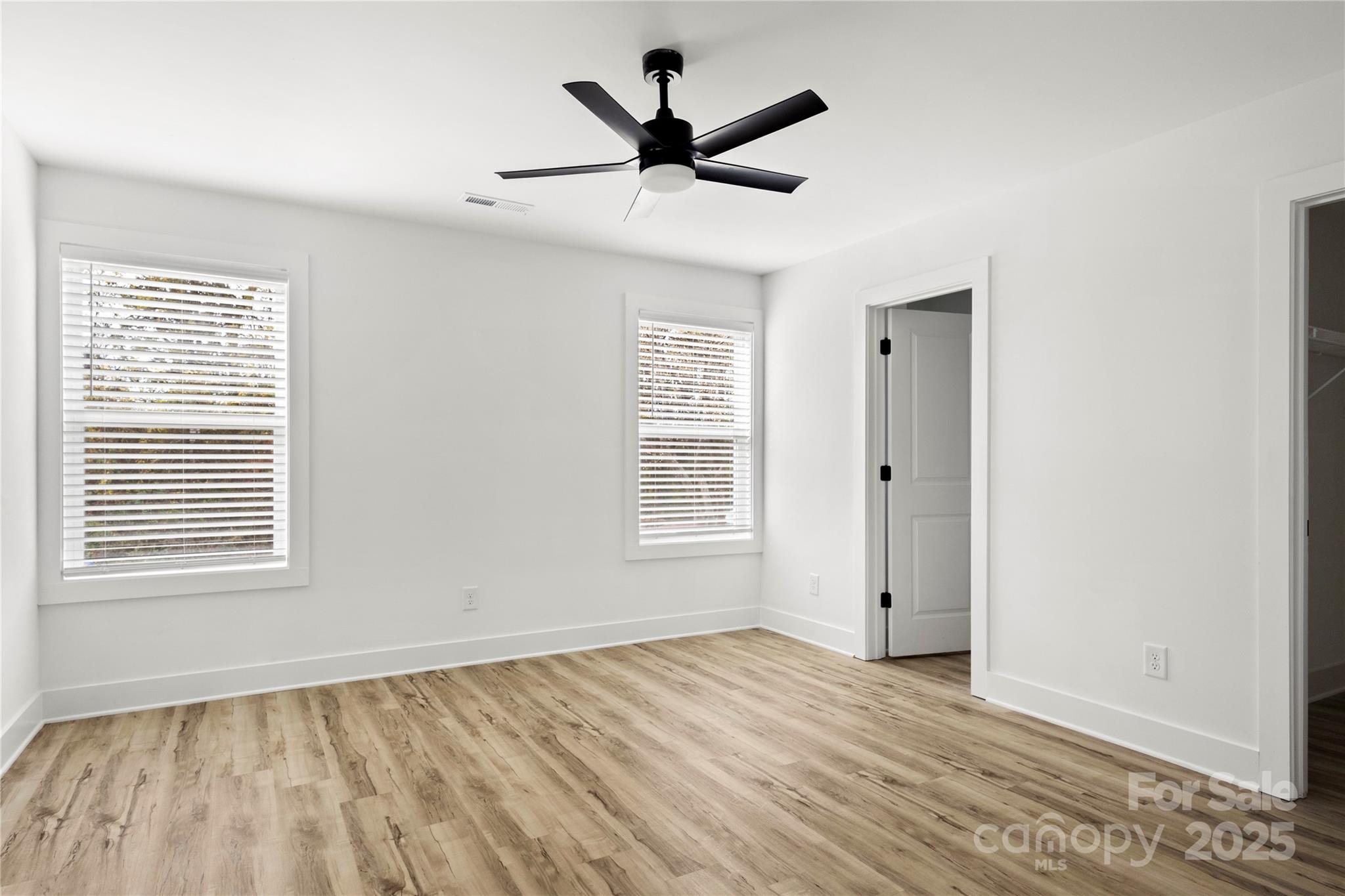 2022 4th Street Southwest Hickory, NC 28602 - Photo 15 of 31 a view of empty room with wooden floor and ceiling fan