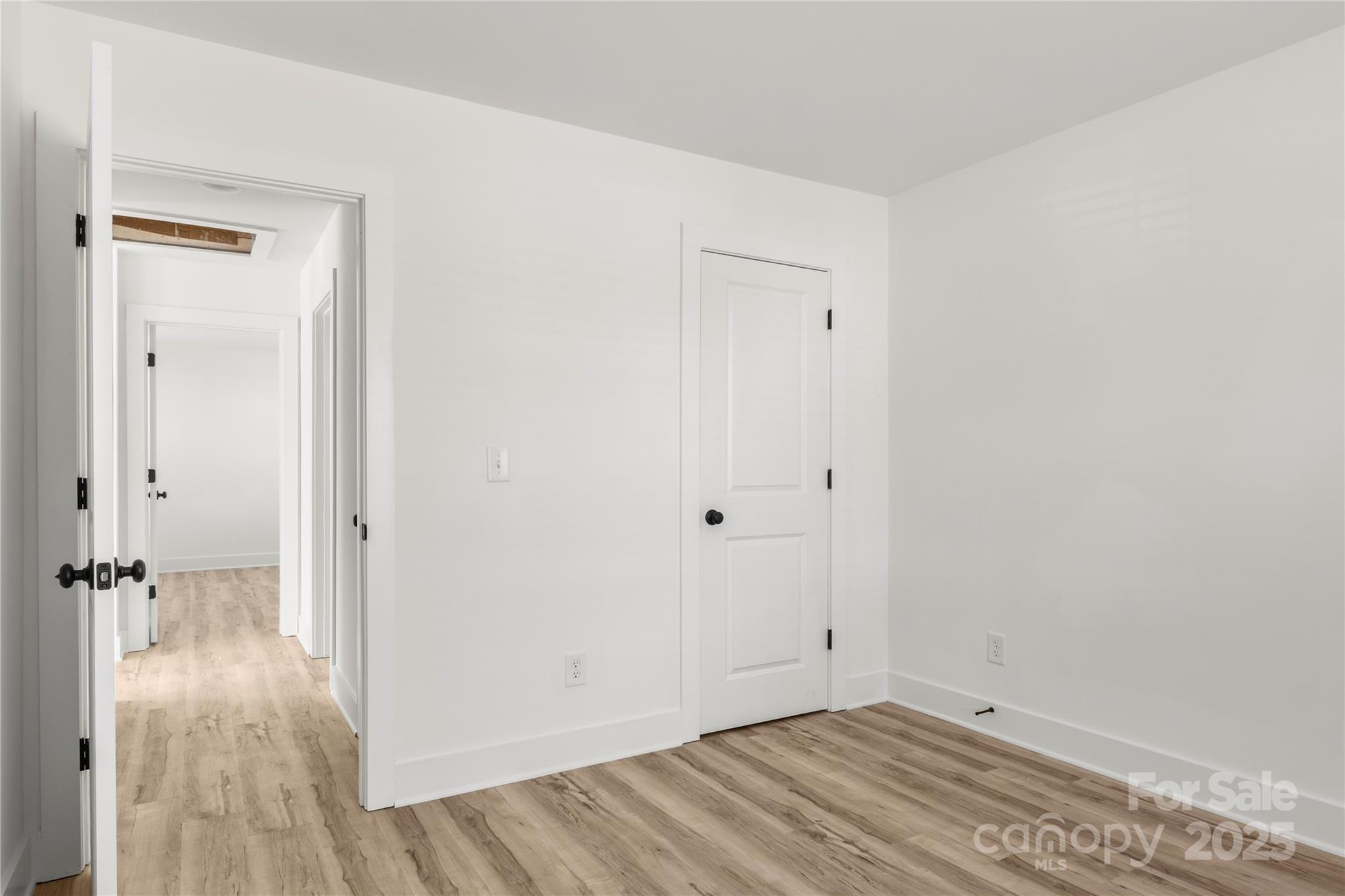 2022 4th Street Southwest Hickory, NC 28602 - Photo 28 of 31 a view of a room with wooden floor