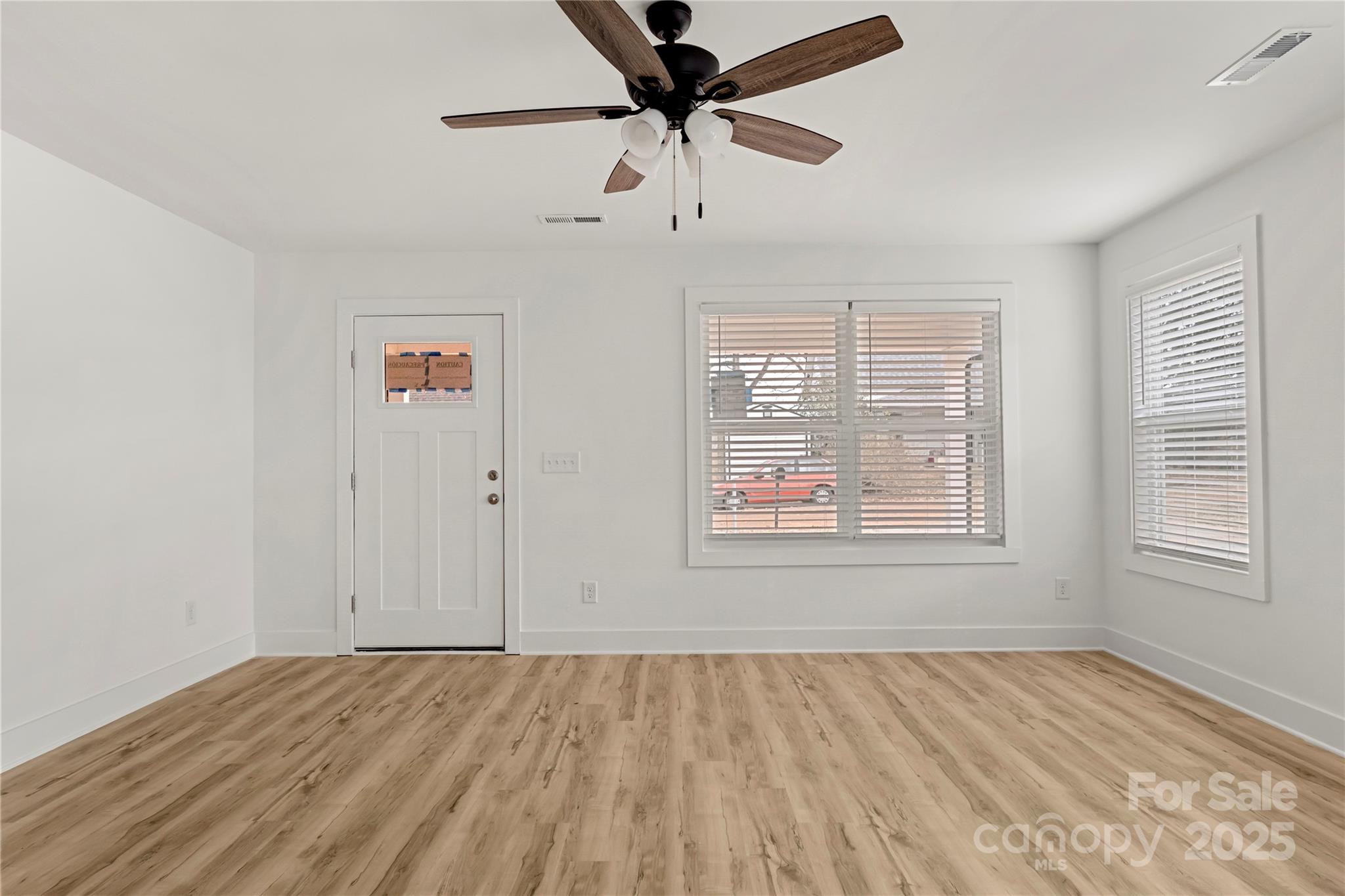 2022 4th Street Southwest Hickory, NC 28602 - Photo 4 of 31 wooden floor in an empty room with a window