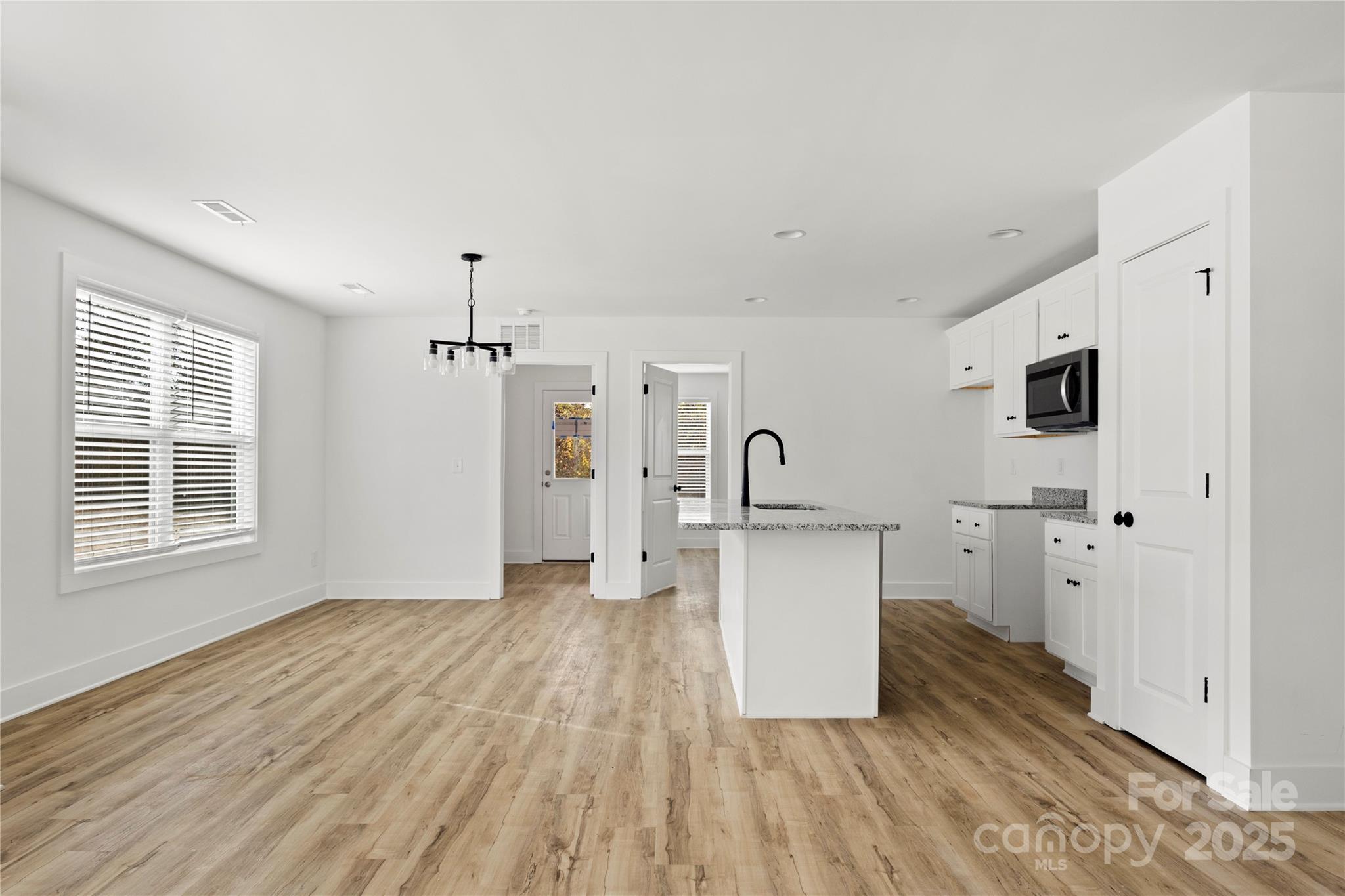 2022 4th Street Southwest Hickory, NC 28602 - Photo 7 of 31 a view of a kitchen with refrigerator and window