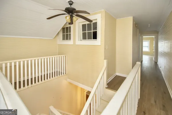 a view of a hallway with a kitchen