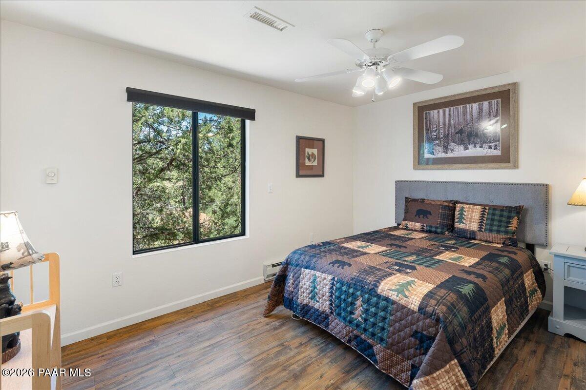 1388 East Pine Ridge Drive Prescott, AZ 86303 - Photo 9 of 16 a bedroom with a large bed and a window