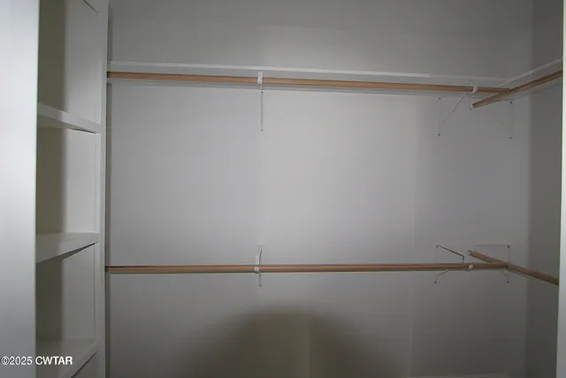 a view of a room with racks on the wall