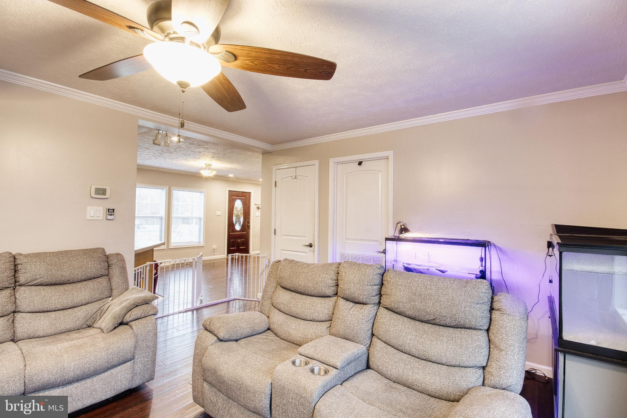 343 Dark Hollow Road Shermans Dale, PA 17090 - Photo 20 of 45 a living room with furniture and a chandelier