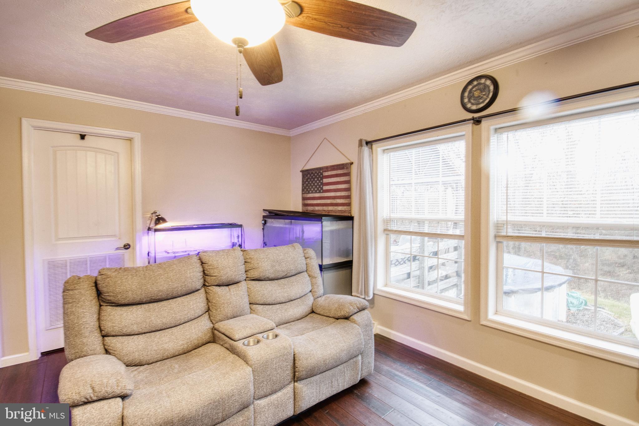 343 Dark Hollow Road Shermans Dale, PA 17090 - Photo 21 of 45 a living room with furniture and a large window