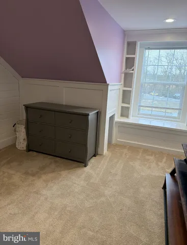 a view of storage and utility room with closet