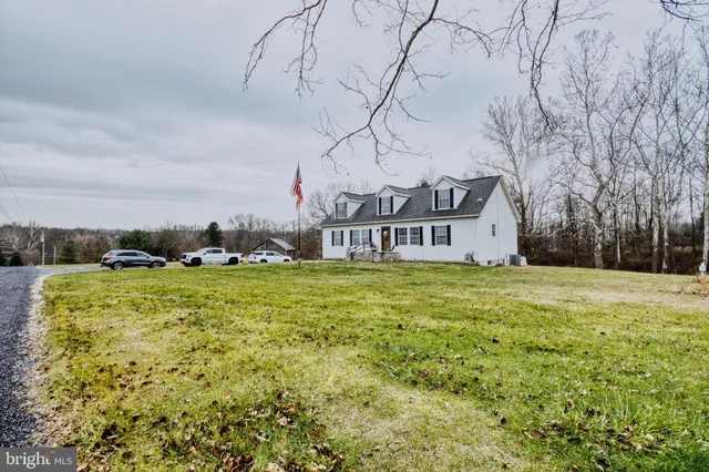 a front view of house with yard and seating area
