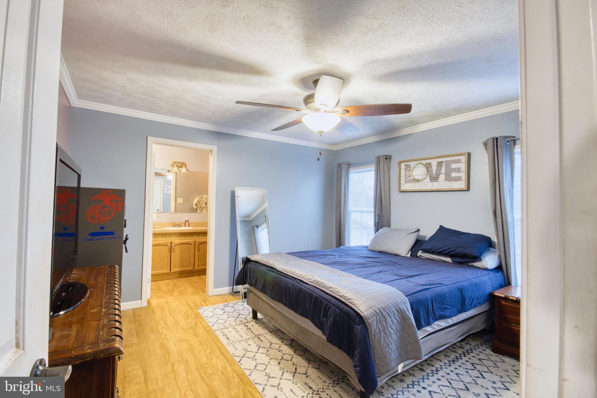 343 Dark Hollow Road Shermans Dale, PA 17090 - Photo 6 of 45 a bedroom with a bed and a chandelier