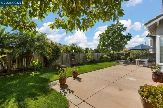 a patio with table and chairs