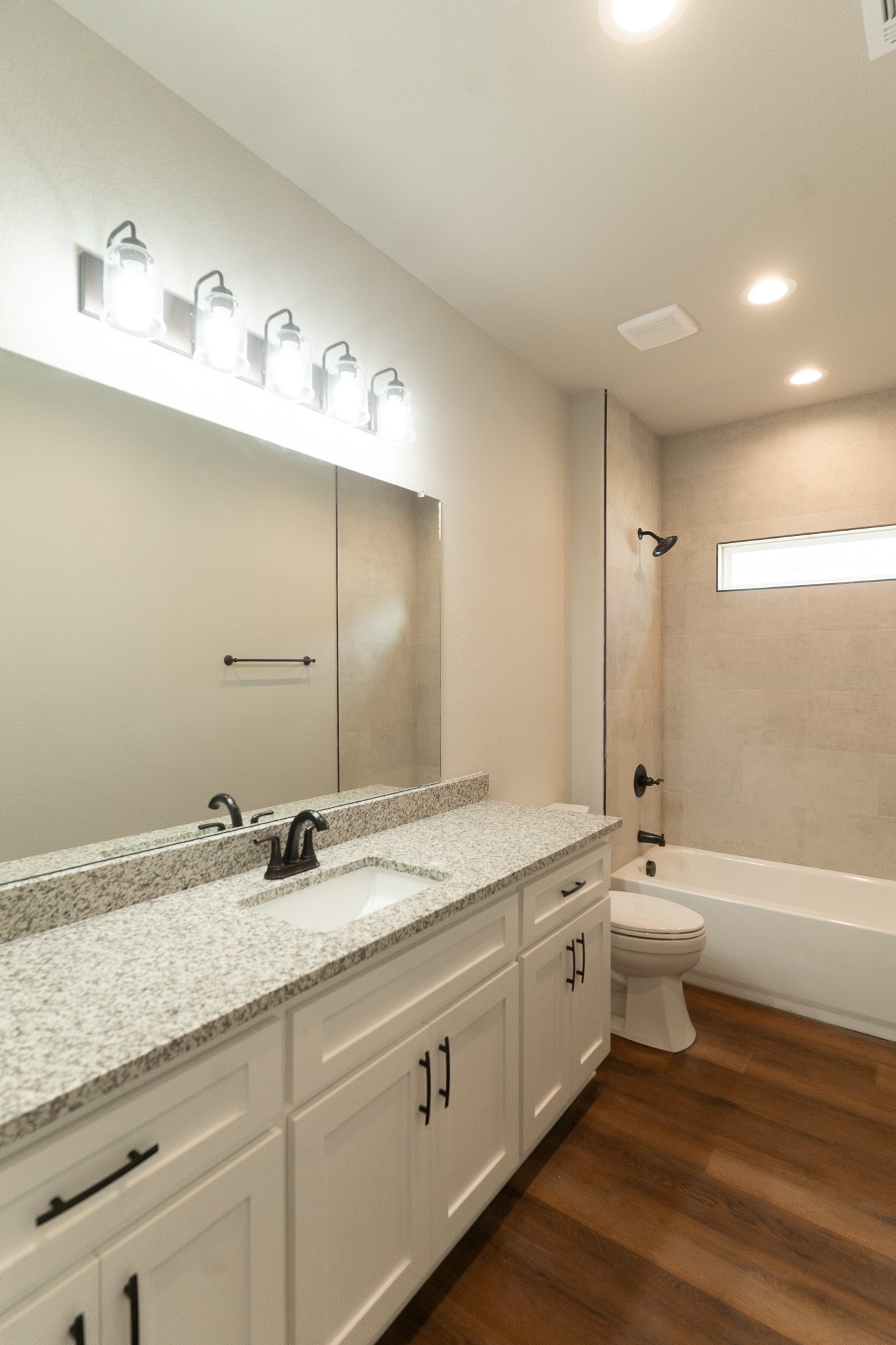 305 String Prairie Way Smithville, TX 78957 - Photo 19 of 26 a bathroom with a double vanity sink and a mirror