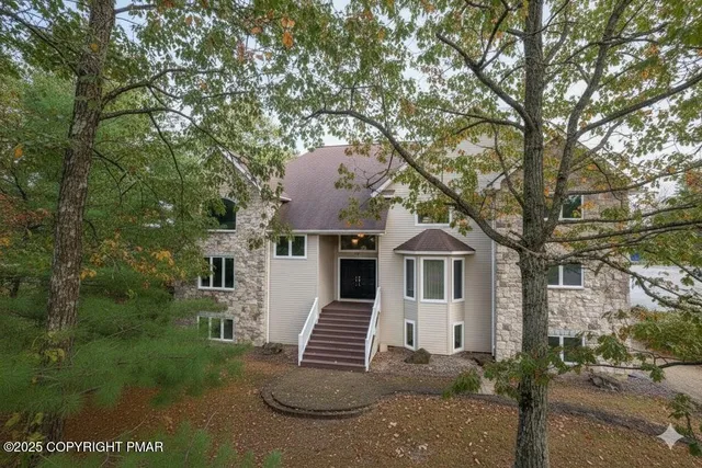 a view of kitchen with furniture and fireplace