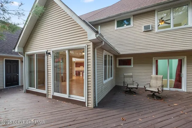 an aerial view of a house with a yard and garden
