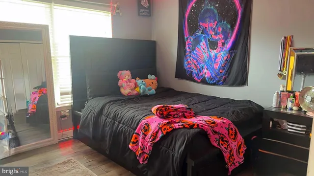 a bedroom with a bed and dresser