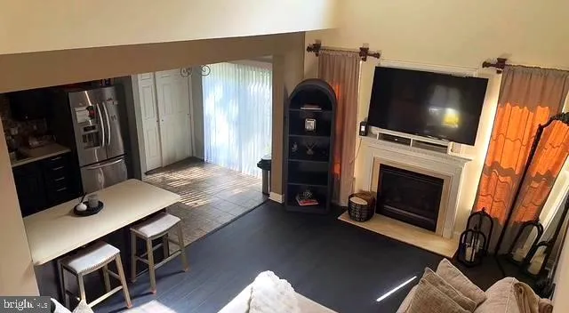 a living room with a fireplace furniture and a flat screen tv