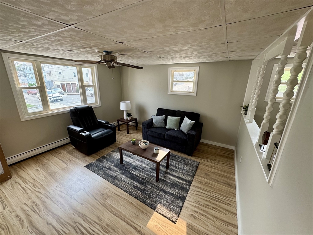 203 Division Street Fall River, MA 02721 - Photo 5 of 12 a living room with furniture and a window