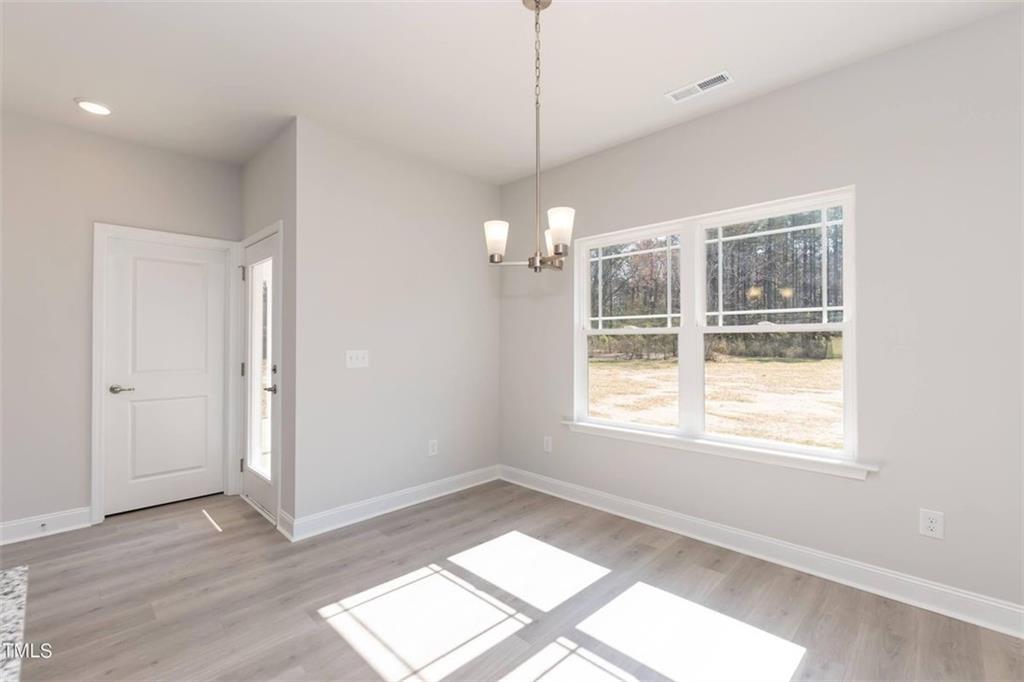654 Bald Ridge Circle Demorest, GA 30535 - Photo 14 of 22 a view of an empty room with wooden floor and windows