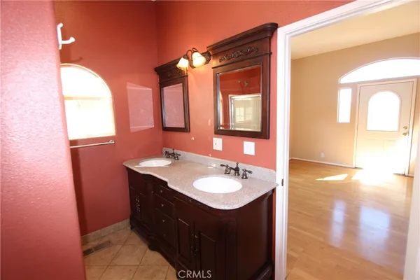 a bathroom with a sink a mirror and a shower