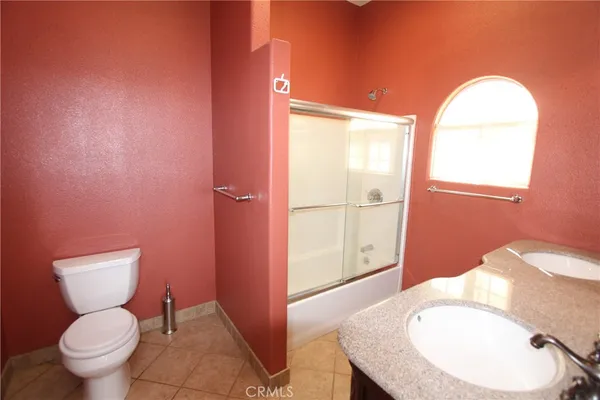 a bathroom with a toilet a sink and bath tub
