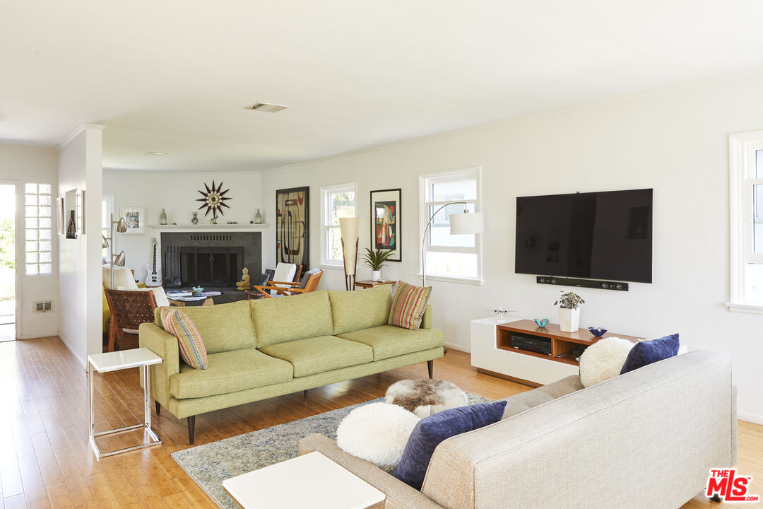3708 Roderick Road Los Angeles, CA 90065 - Photo 1 of 38 a living room with furniture and a flat screen tv