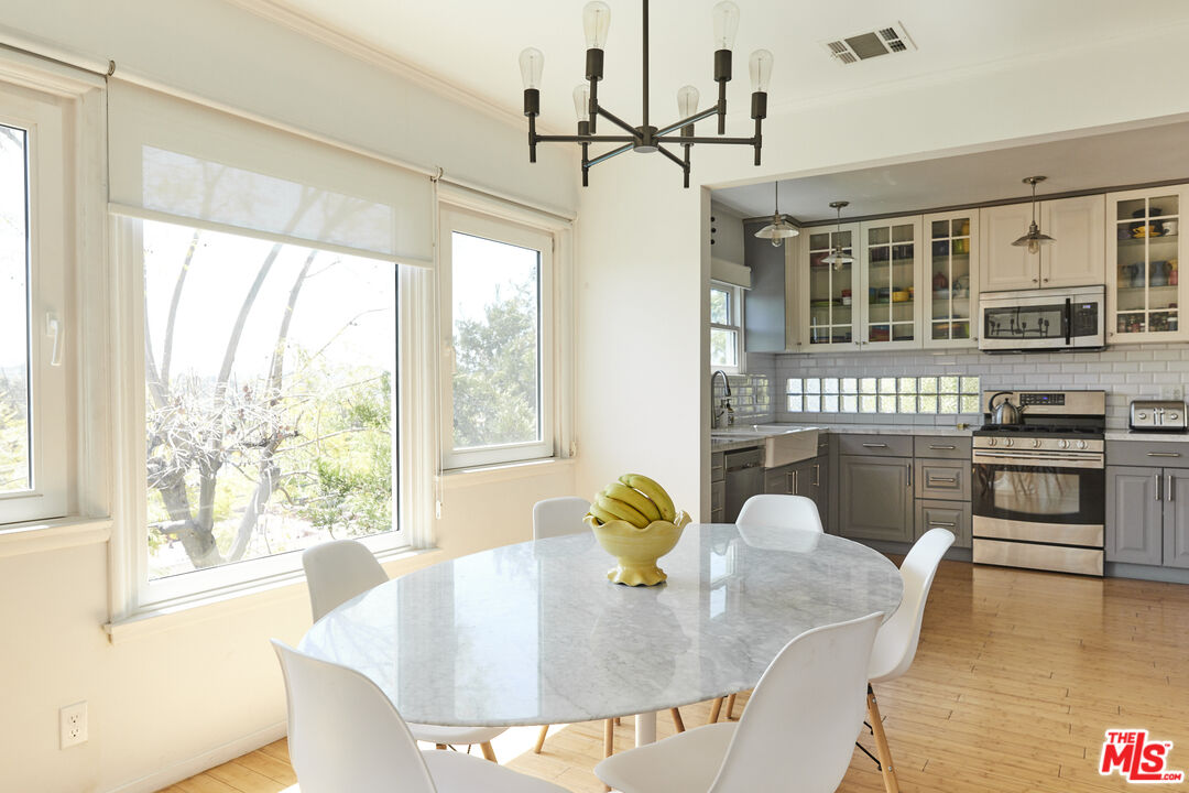 3708 Roderick Road Los Angeles, CA 90065 - Photo 12 of 38 a view of a dining room with furniture window and wooden floor