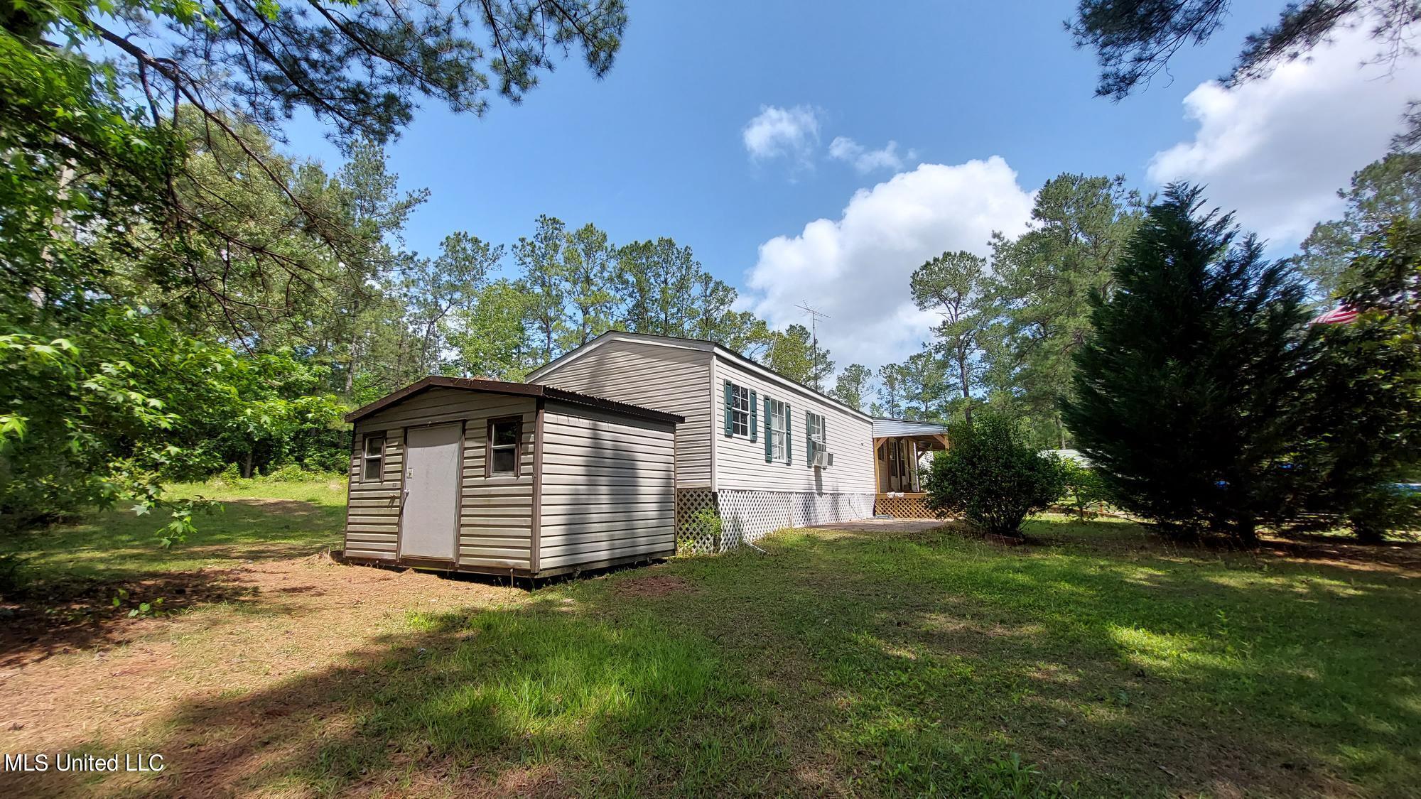 227 Go Go Road Poplarville, MS 39470 - Photo 3 of 23 side