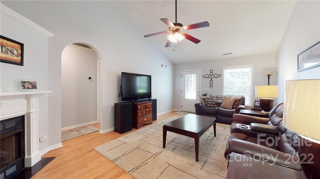 1447 George Dunn Road Rock Hill, SC 29730 - Photo 12 of 44 a living room with furniture a flat screen tv and a fireplace