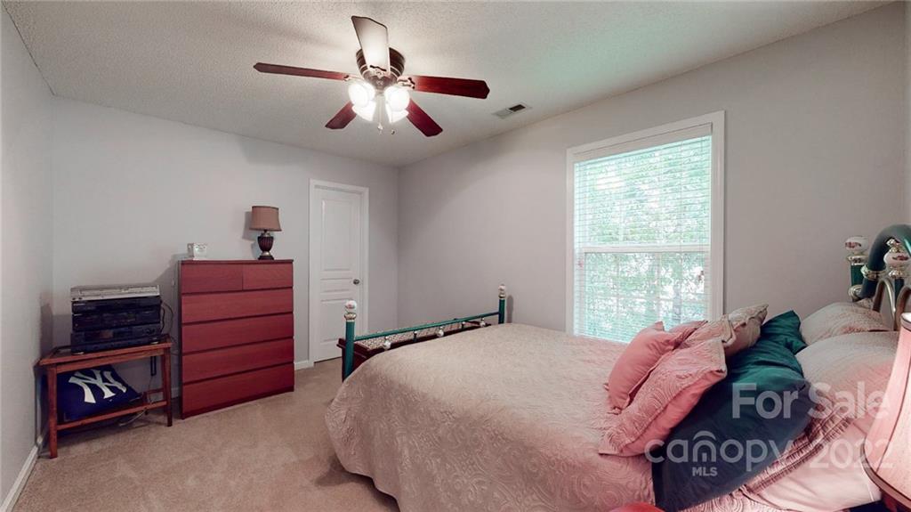1447 George Dunn Road Rock Hill, SC 29730 - Photo 15 of 44 a bedroom with a bed and a dresser