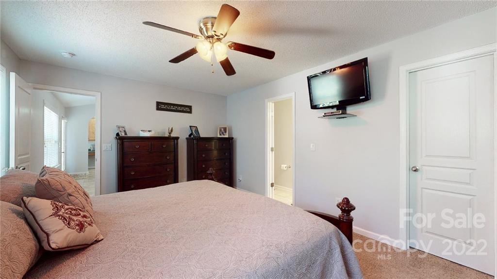 1447 George Dunn Road Rock Hill, SC 29730 - Photo 25 of 44 a bedroom with a bed and a flat screen tv