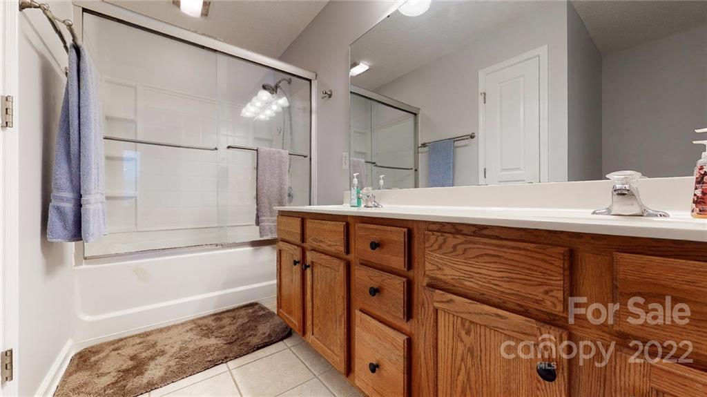 1447 George Dunn Road Rock Hill, SC 29730 - Photo 27 of 44 a bathroom with a tub sink and mirror