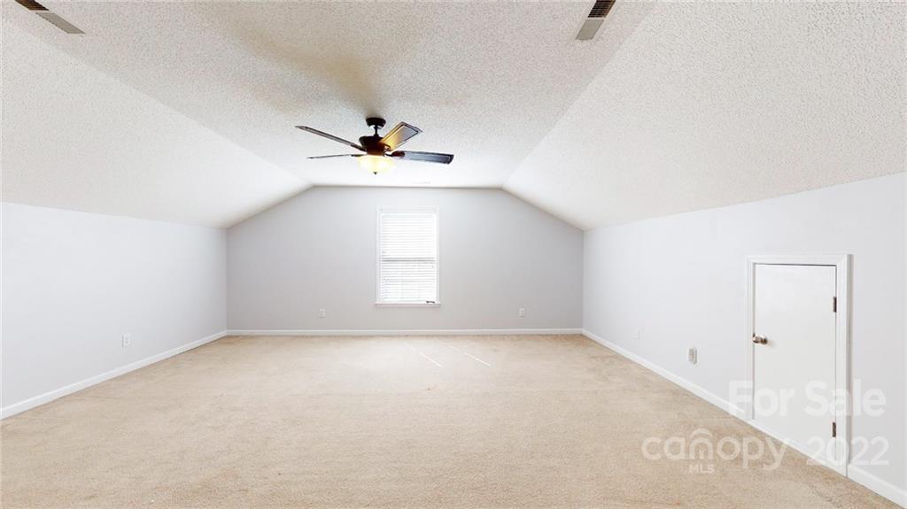 1447 George Dunn Road Rock Hill, SC 29730 - Photo 29 of 44 an empty room with windows and fan