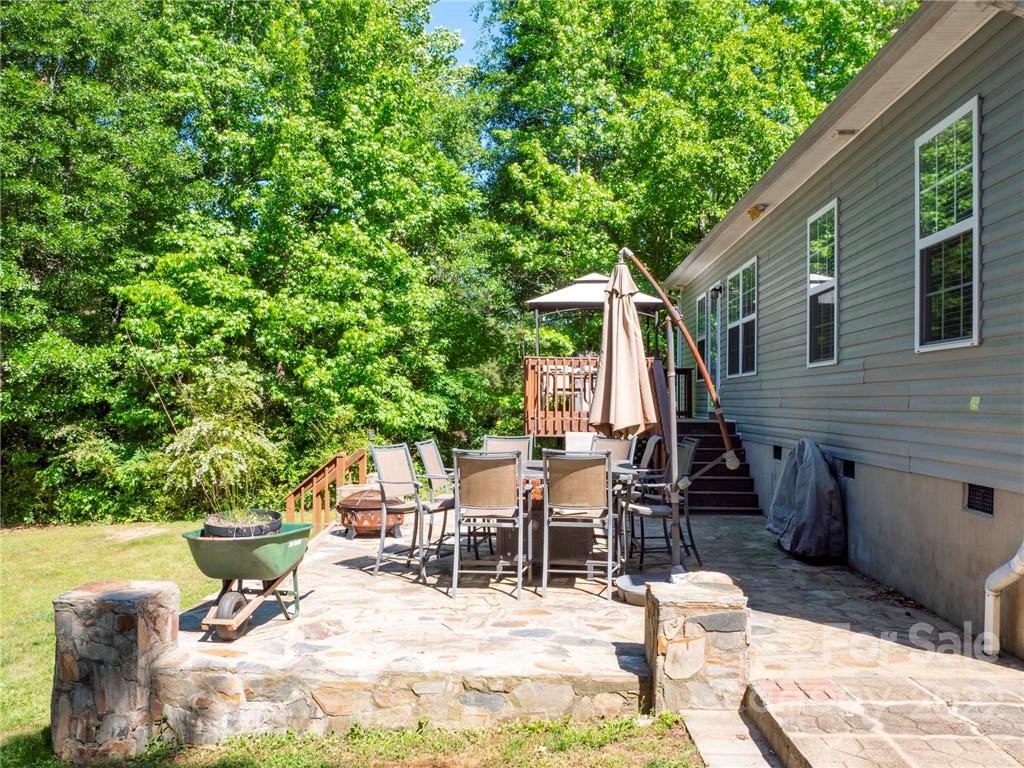 1447 George Dunn Road Rock Hill, SC 29730 - Photo 33 of 44 a view of a patio with table and chairs and potted plants