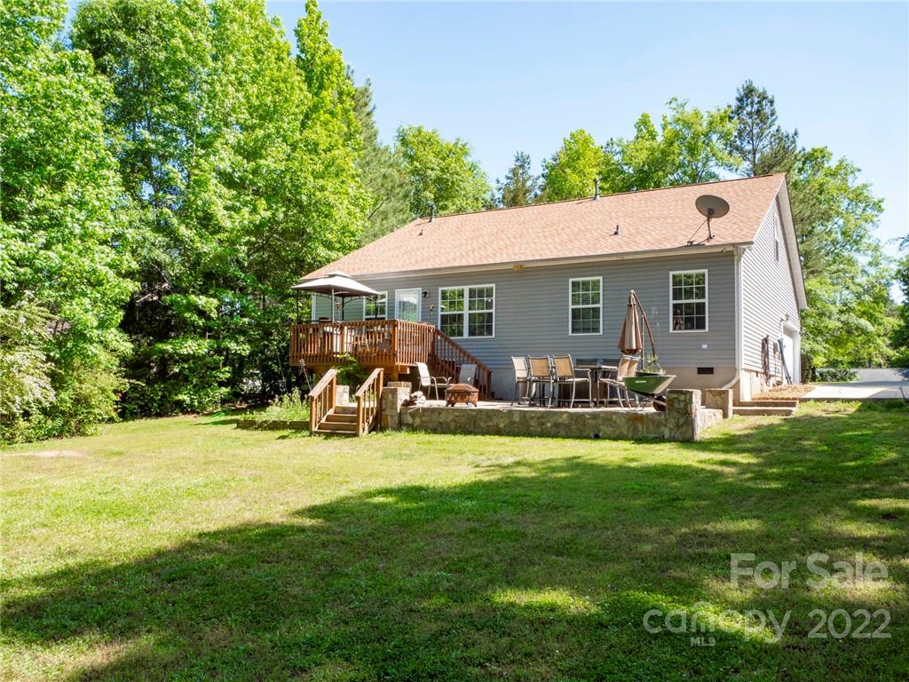 1447 George Dunn Road Rock Hill, SC 29730 - Photo 41 of 44 a view of a backyard with table and chairs and a small yard