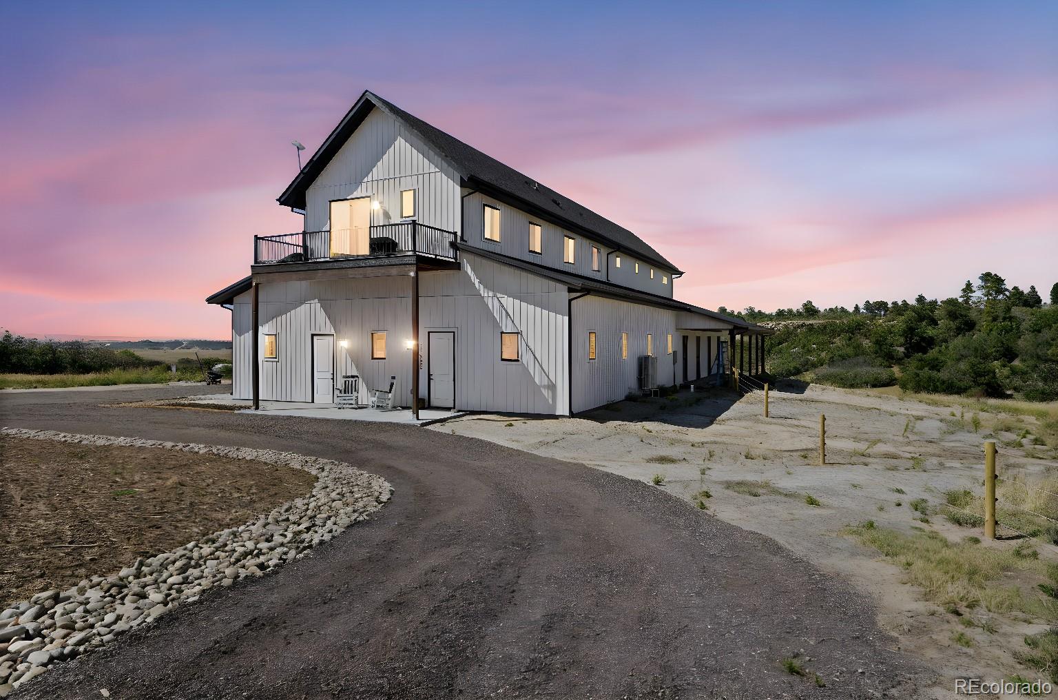 Lot 4 Wildstone Ranch Elbert, CO 80106 - Photo 12 of 42 a front view of a house with a yard