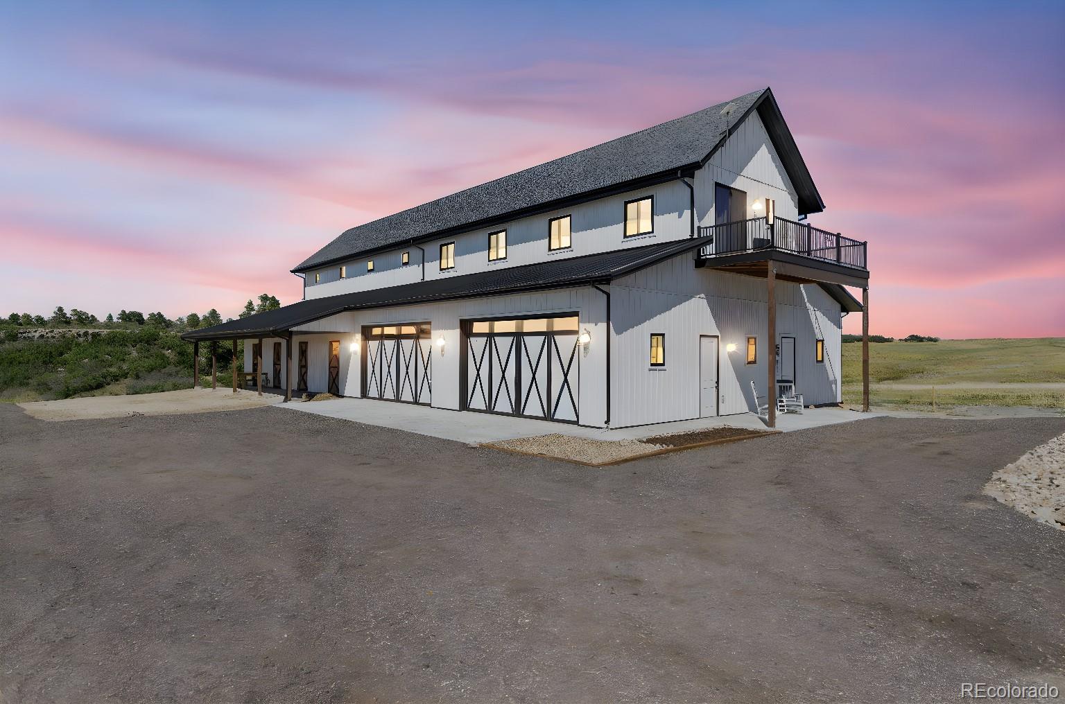 Lot 4 Wildstone Ranch Elbert, CO 80106 - Photo 14 of 42 a front view of a house with a road
