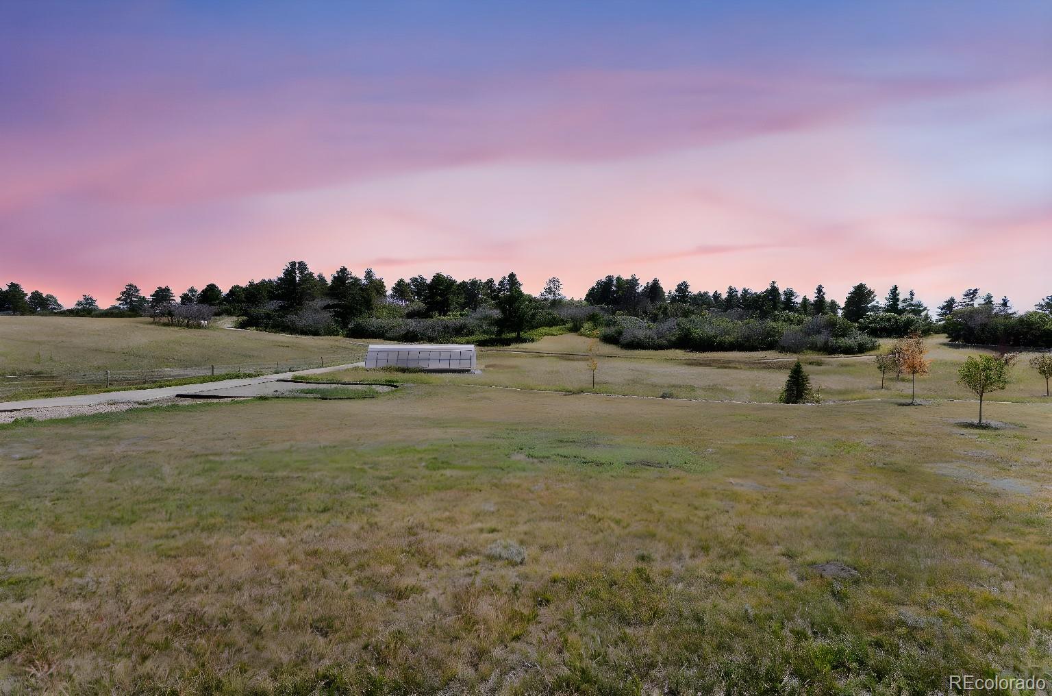 Lot 4 Wildstone Ranch Elbert, CO 80106 - Photo 2 of 42 a view of a lake with trees in the background
