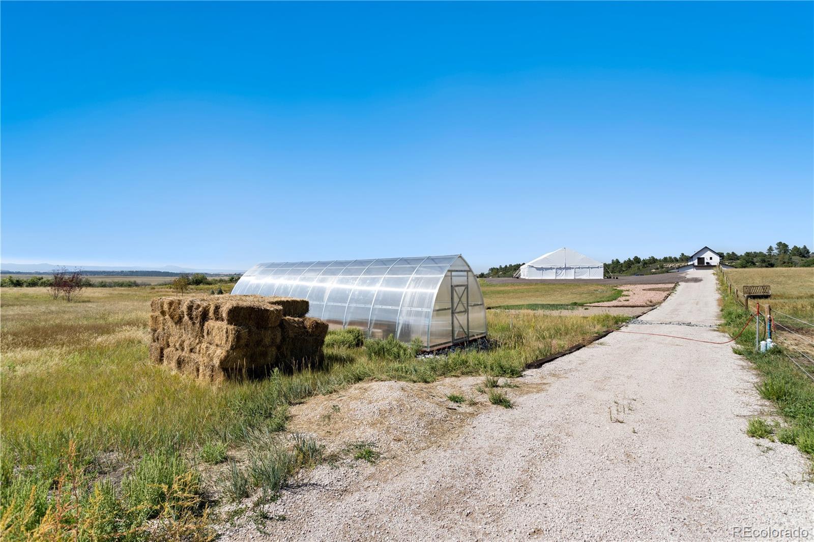 Lot 4 Wildstone Ranch Elbert, CO 80106 - Photo 23 of 42 a view of a lake with a building in the background