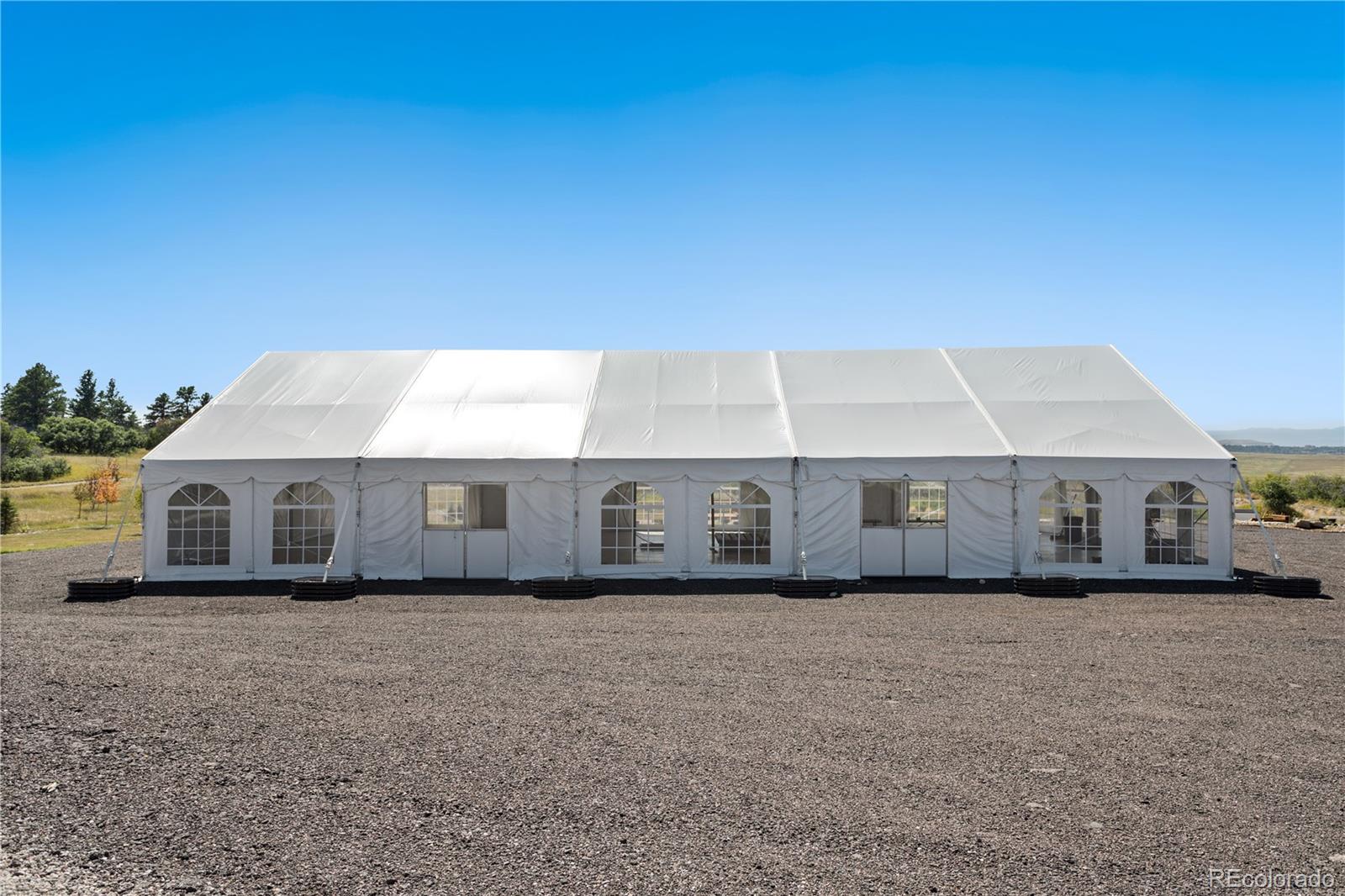 Lot 4 Wildstone Ranch Elbert, CO 80106 - Photo 27 of 42 a front view of a house with a garden