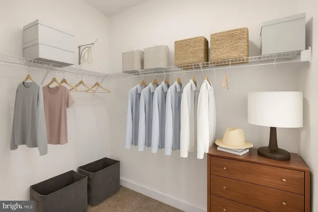 a bedroom with a bed and a lamp