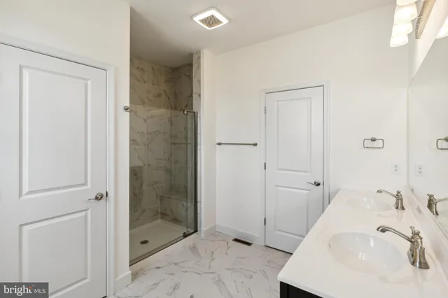 a bathroom with a sink and a shower