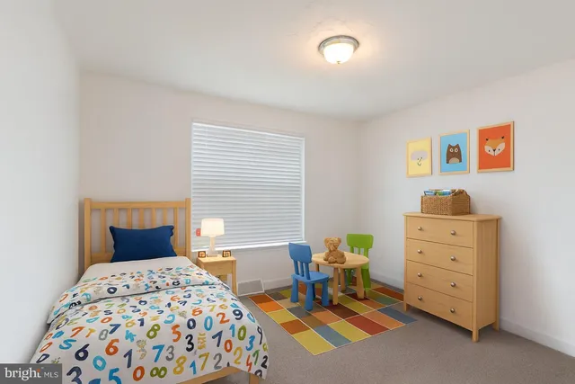 a bedroom with a bed and a cabinets