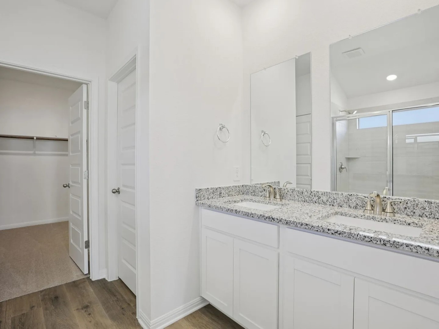 486 El Capitan Loop Dripping Springs, TX 78620 - Photo 5 of 20 a bathroom with a granite countertop sink and a mirror