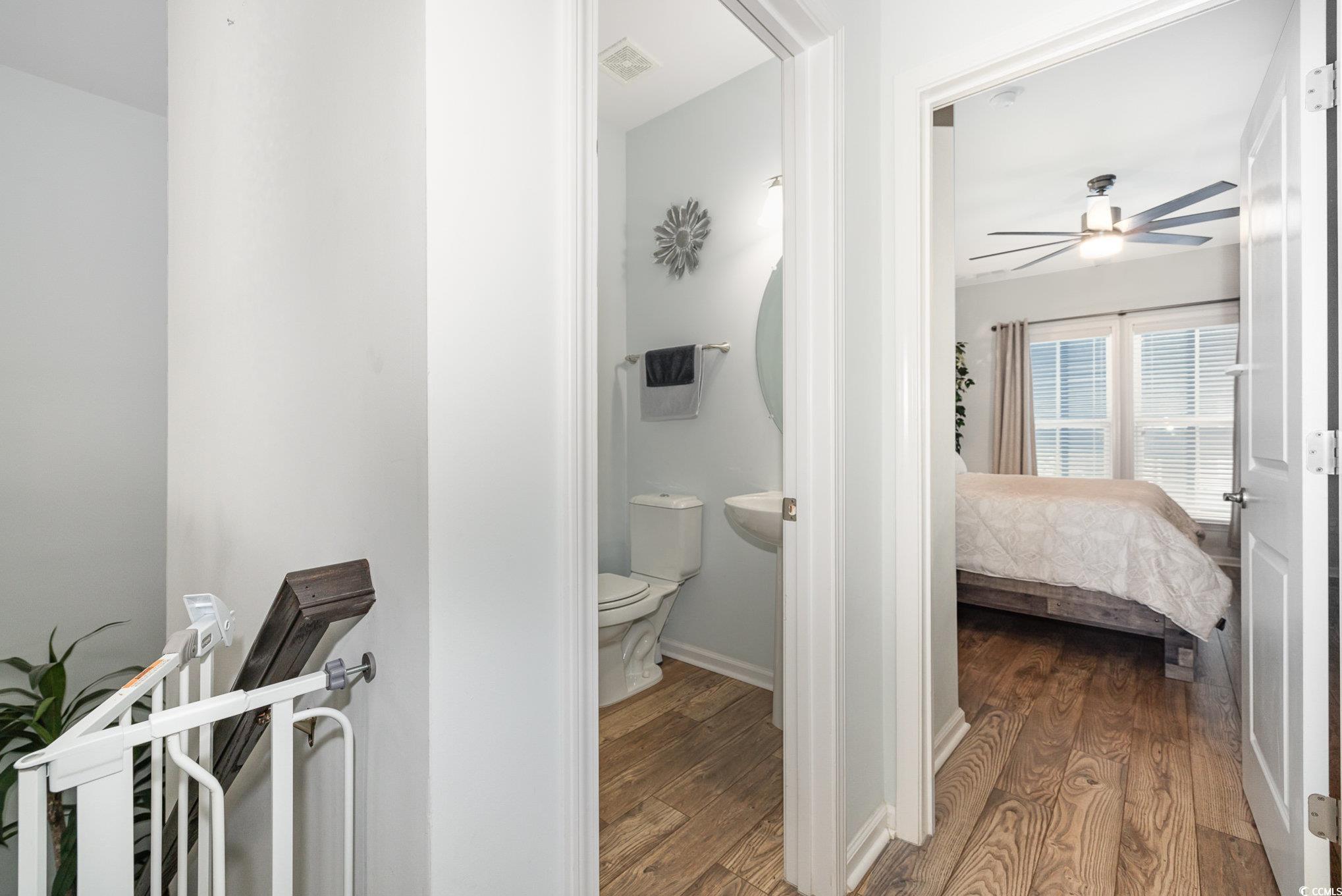 136 Splendor Circle Murrells Inlet, SC 29576 - Photo 13 of 30 Ensuite bathroom featuring toilet, baseboards, visible vents, ceiling fan, and wood finished floors