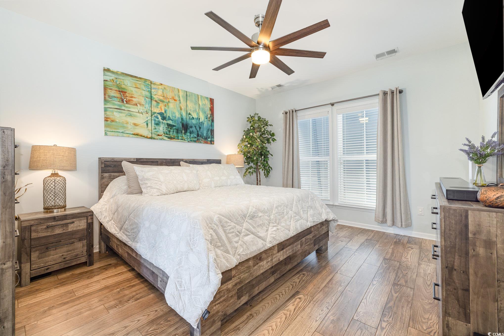 136 Splendor Circle Murrells Inlet, SC 29576 - Photo 14 of 30 Bedroom with a ceiling fan, light wood-style flooring, baseboards, and visible vents