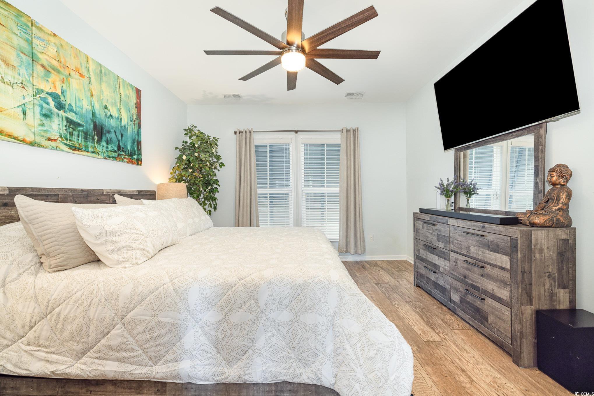 136 Splendor Circle Murrells Inlet, SC 29576 - Photo 15 of 30 Bedroom with baseboards, ceiling fan, visible vents, and light wood-style floors